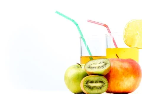 Different fruit and juice or smoothie in a glass Stock Photos