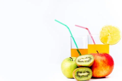 Different fruit and juice or smoothie in a glass Stock Photos