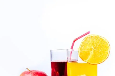 Different fruit and juice or smoothie in a glass Stock Photos