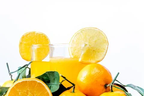 Different fruit and juice or smoothie in a glass Stock Photos