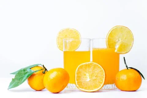 Different fruit and juice or smoothie in a glass Stock Photos