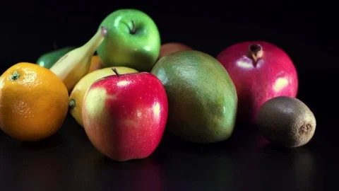 Different fruit on black background, panning Video stock 75824557