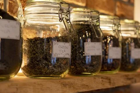 Different fruit teas standing in jars Stock Photos
