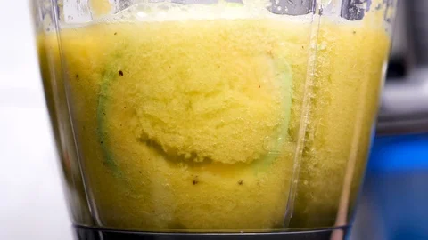 Different fruits getting mixed in blender Stock Footage 87394341