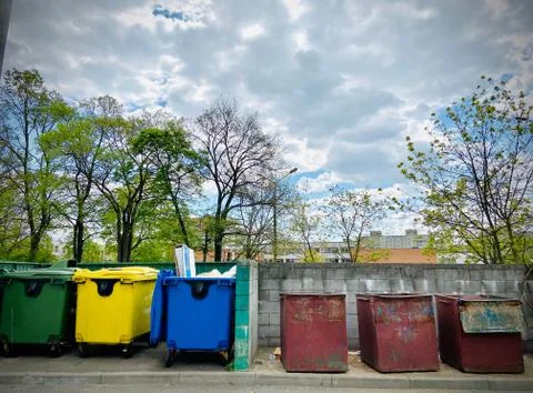 Different garbage containers on the street. Mobile photo. Summer Stock-Fotos