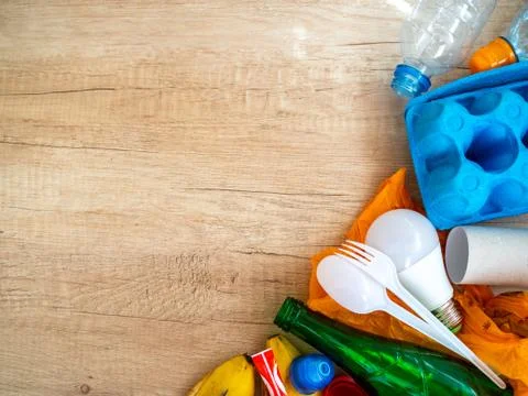 Different garbage on wooden background, top view. Reuse, reduce, recycle concept Stock Photos
