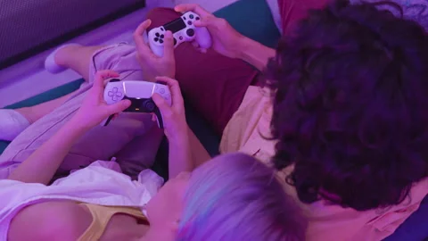 Different generations of PlayStation console controllers: PS5 DualSense Stock Footage 144360383