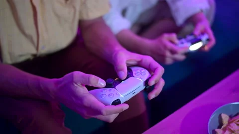 Different generations of PlayStation console controllers: PS5 DualSense Stock-Footage 144420496