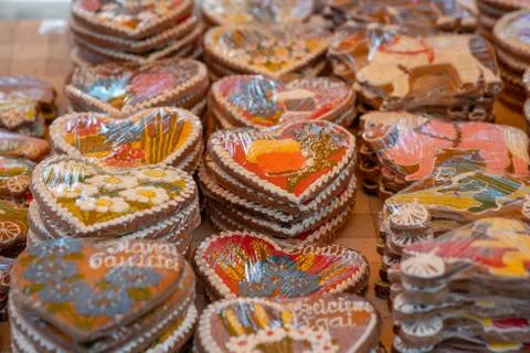 Different gingerbread hearts in the store on the table. Stock Photos