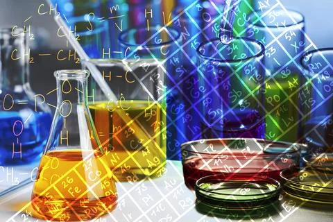 Different glassware with samples, periodic table of elements and different .. Stock Photos