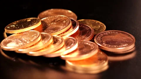 Different gold coins lie unsorted next to each other Stock Footage 168277619