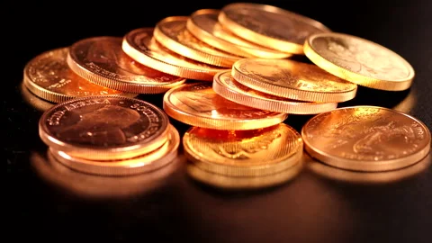 Different gold coins lie unsorted next to each other Stock Footage 168277625