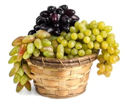 Different grape varieties in the basket Stock Photos