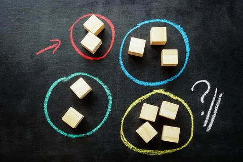 Different groups of cubes with chalk marks. Marketing segmentation of customers. Stock Photos