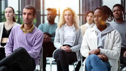 Different groups of people communicate with each other during business seminar Stock Photos