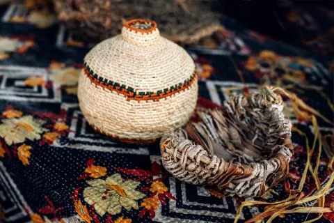 Different hand made weave basckets on table. Craft workshop. Close up shot Stock Photos