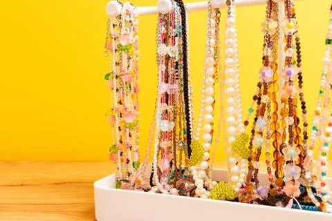Different handmade chains of beads, pearls and natural stones. Stock Photos
