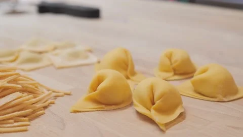 Different handmade pasta are exhibited on wooden counter Stock-Footage 131149463