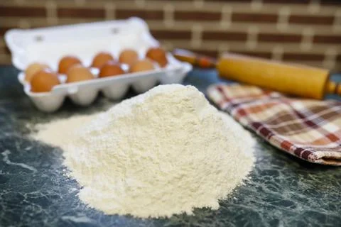 Different ingredients for preparing flour products on kitchen table 스톡 사진