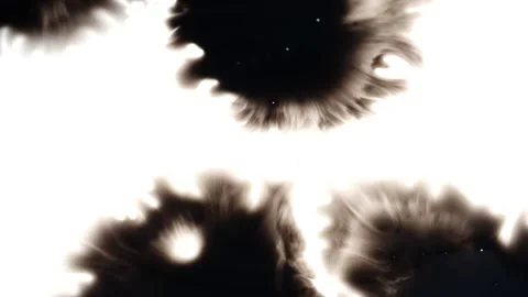 Different ink blots spreading on white background Stock Footage 147703223
