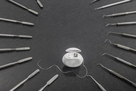 Different instruments with white dental floss.Top view Stock Photos
