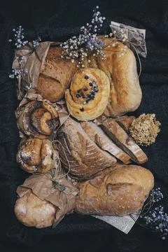 Different kind of bread and bread rolls in a retro style box. Stock Photos
