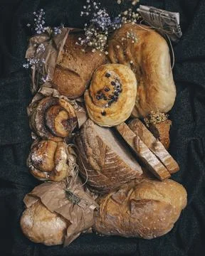 Different kind of bread and bread rolls in a retro style box. Stock Photos