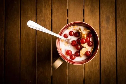 A different kind of breakfast with cereal, milk and ribes Stock Photos