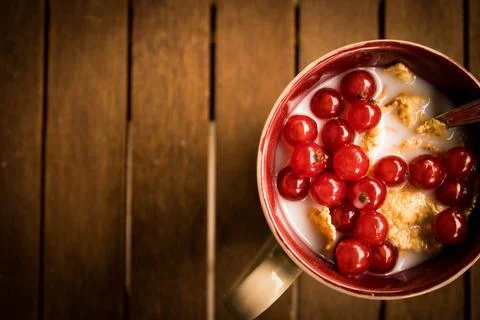 A different kind of breakfast with cereal, milk and ribes Stock Photos