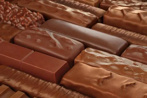Different kind of Chocolate bars background Stock Photos