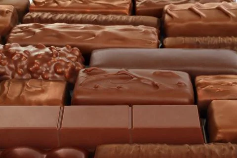 Different kind of Chocolate bars background Stock Photos