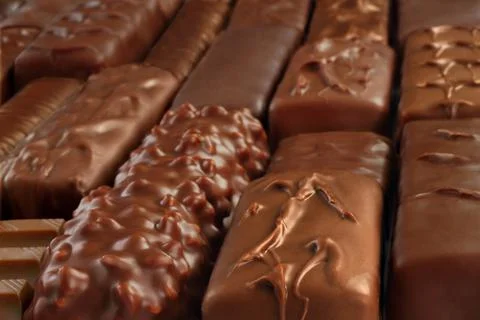 Different kind of Chocolate bars background Stock Photos