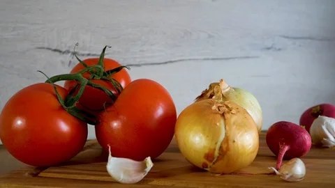 Different kind of fresh vegetables are shown on kitchen table Stock Footage 106734206