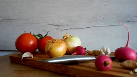 Different kind of fresh vegetables are shown on kitchen table Stock Footage 106778092