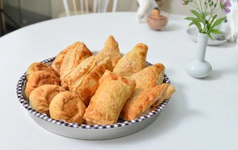 Different kind of freshly baked bread on white table Stock Photos