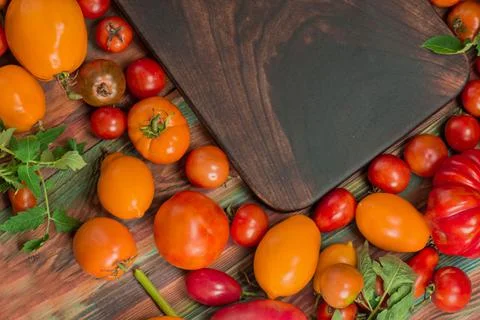 Different kind tomatoes closeup assorted. Red and yellow tomatoes Фото