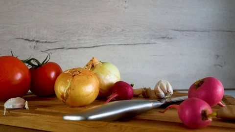Different kind of vegetables are shown on kitchen table Stock Footage 106733696