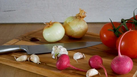 Different kind of vegetables are shown on kitchen table Stock Footage 106782070
