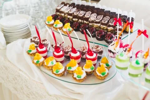 Different kinds of baked sweets on a buffet Stock Photos