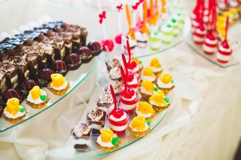 Different kinds of baked sweets on a buffet Stock Photos