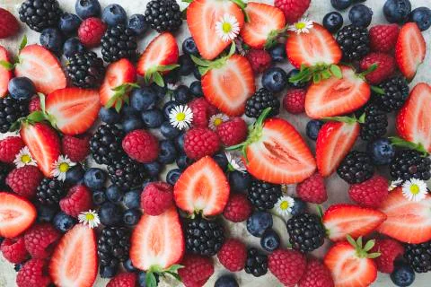 Different kinds of berries on background Stock Photos