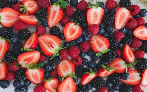 Different kinds of berries on background Foto stock