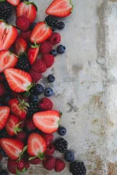 Different kinds of berries on background Foto stock