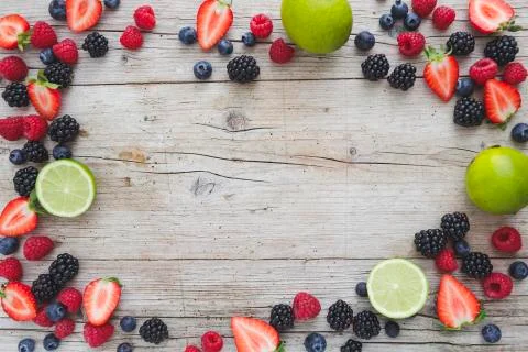 Different kinds of berries on background Stock Photos