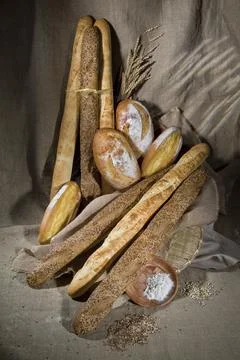 Different kinds of bread and pastry on a canvas studio background Stock Photos