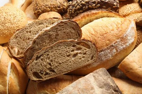 Different kinds of bread as background, closeup Foto stock