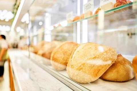 Different kinds of bread on the counter in the bakery shop. Fresh bread counter Stock Photos