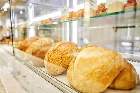 Different kinds of bread on the counter in the bakery shop. Fresh bread counter Stock Photos