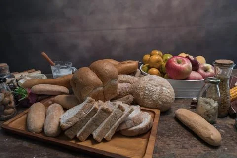 Different kinds of bread rolls on table wooden from above. Kitchen or bakery Фото