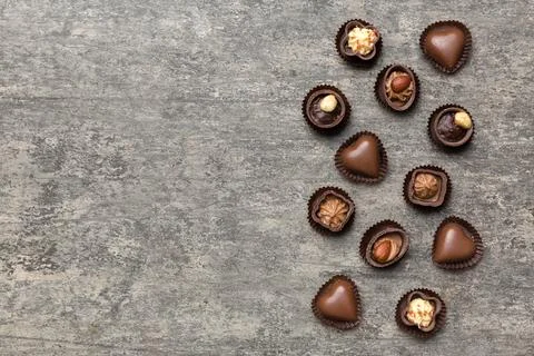 Different kinds of chocolates on colored table close-up. Top View and Flat La Stock Photos